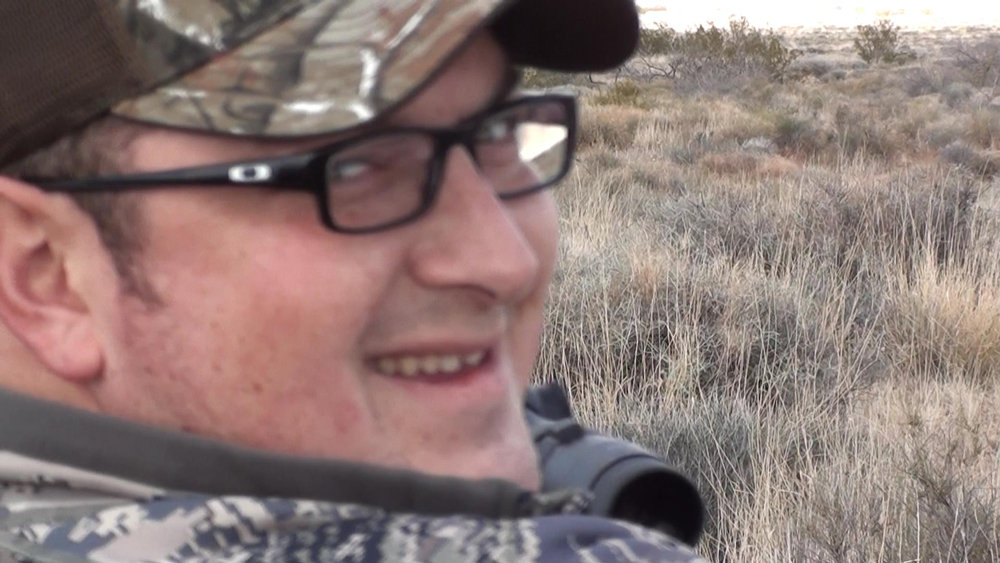 Wayne all smiles after shooting his first coyote, while on a guided predator hunting trip in Arizona.  