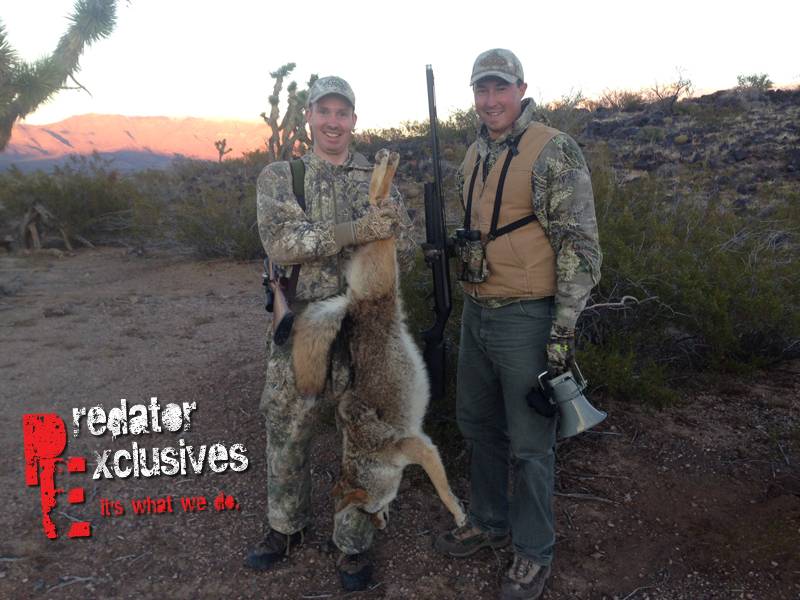 Ian holding the biggest coyote of the guided predator hunting trip in Arizona.  